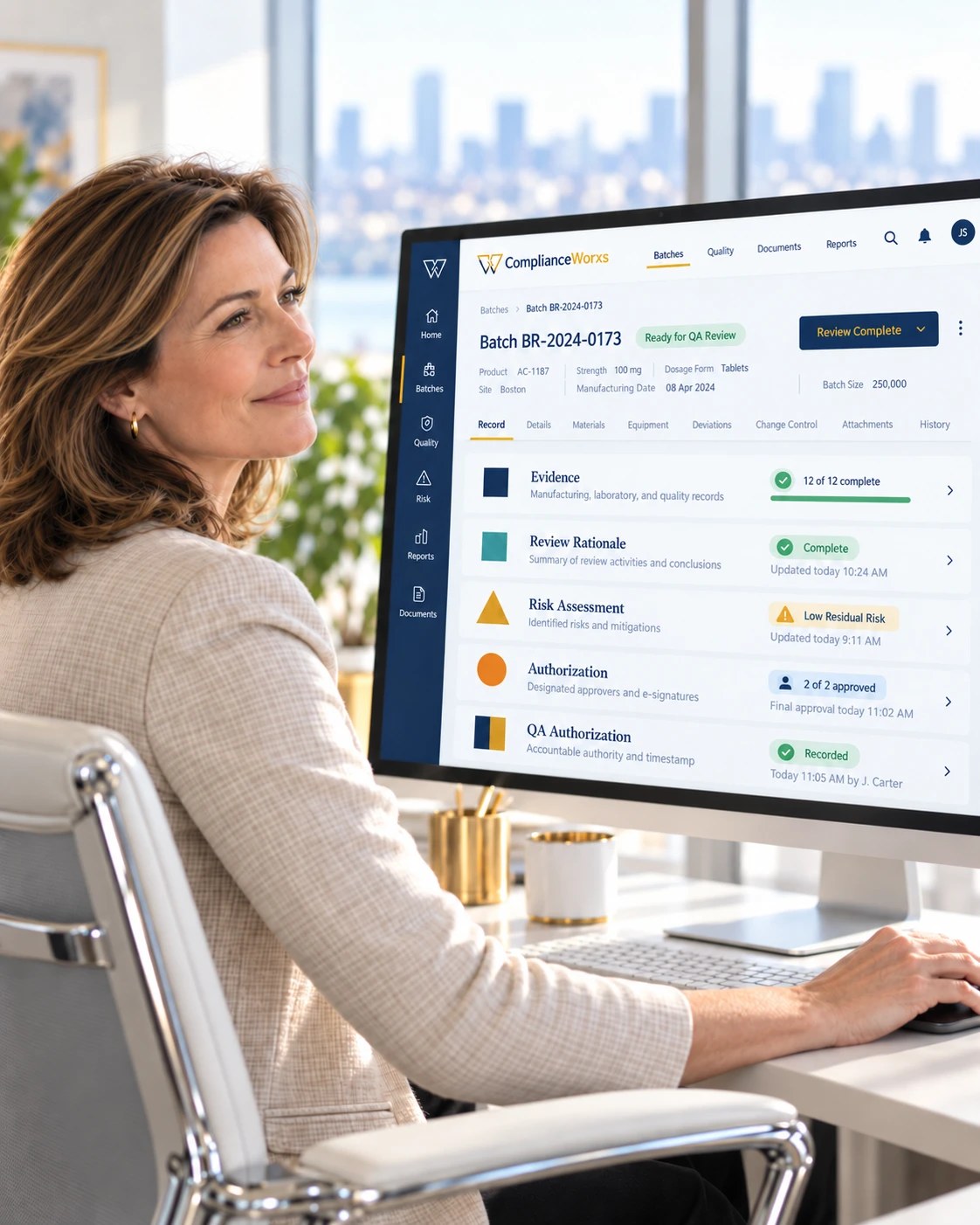A Quality leader reviews a completed batch-release record on her screen, with evidence, review rationale, risk, authorization and the release decision all in one place